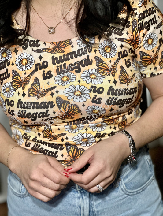 NO HUMAN IS ILLEGAL (bright)